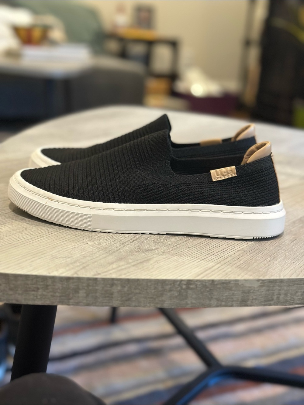 UGG Black Knit Slip-On Sneakers with White Platform and Tan Pull Tab